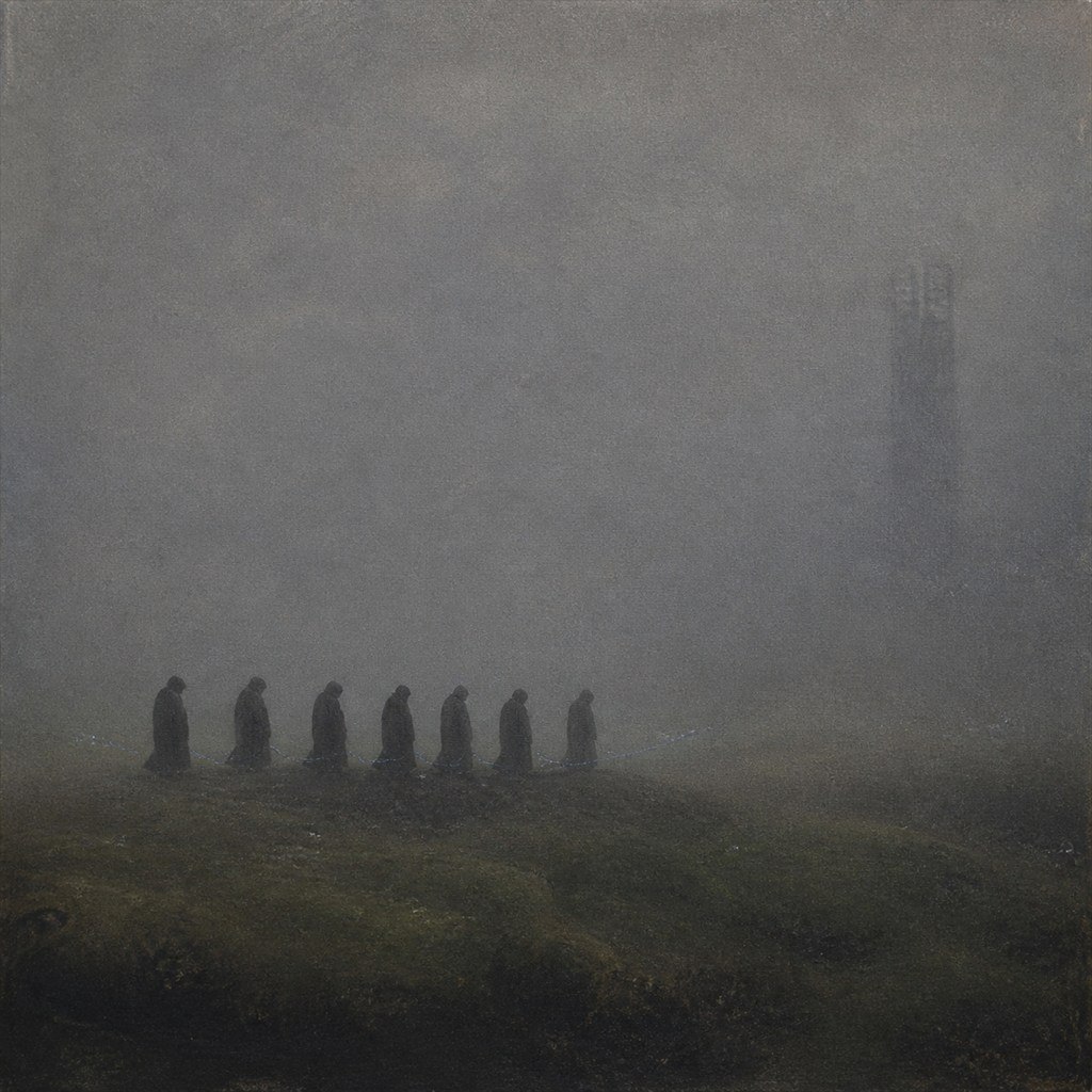 A distant procession disappears into dense gray fog across an empty field.
